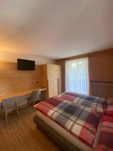 Postel nebo postele na pokoji v ubytování Hotel Compagnoni