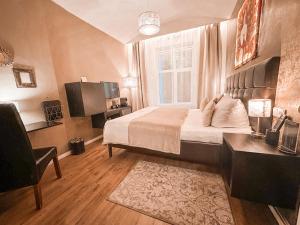 Posteľ alebo postele v izbe v ubytovaní Alfons Boutique Hotel