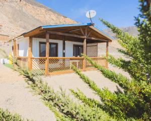 a small building in the middle of a mountain at Cabañas Rincon de Atacama in El Barquito