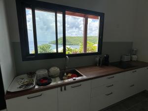 Nhà bếp/bếp nhỏ tại Cap KARAIB villa 2 chambres