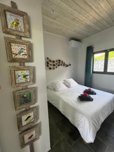Giường trong phòng chung tại Cap KARAIB villa 2 chambres