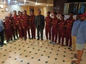 a group of men in red uniforms posing for a picture at PAK Heritage Hotel in Lahore