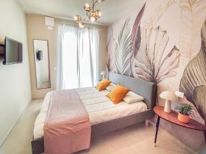 Ένα ή περισσότερα κρεβάτια σε δωμάτιο στο Splendida casa Sofia a due passi dalla spiaggia
