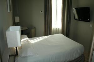 Łóżko lub łóżka w pokoju w obiekcie Antinéa
