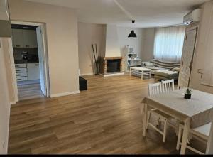 a living room with a table and a living room with a couch at La Cañada in Partida de La Cañada