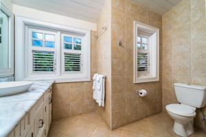 a bathroom with a toilet and a sink at Clearwater home in Saint Peter