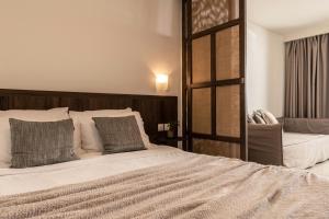 Postel nebo postele na pokoji v ubytování Planos Deluxe