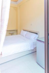 Ένα ή περισσότερα κρεβάτια σε δωμάτιο στο 頭城遊龍戲鳳賞鯨會館