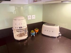 a kitchen counter with a mixer and a toaster at Taylor - 2 pers - Appartement Dinan in Dinan