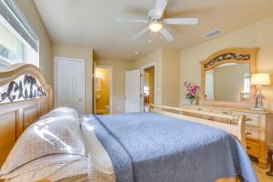 a bedroom with a blue bed and a mirror at On Lake Istokpoga Lorida Home with Lanai! in Sebring