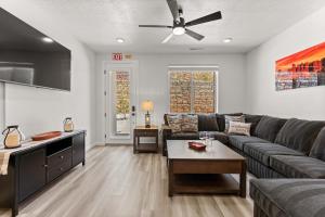 a living room with a couch and a ceiling fan at Terra Retreat #9 condo in Hurricane