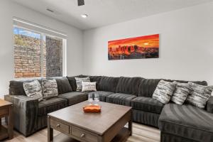a living room with a couch and a table at Terra Retreat #9 condo in Hurricane
