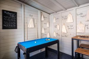 a pool table in a room with a chalkboard at Laburnum Cottage Lanchester- Escape Beyond Holiday Lets in Lanchester
