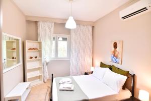 Ένα ή περισσότερα κρεβάτια σε δωμάτιο στο Adam's Villa