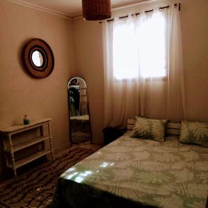 a bedroom with a bed and a window at Aghroud bay house in Agadir +12 photos