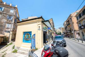 a group of motorcycles parked on the side of a street at Luna Apartment No3 in Ágios Rókkos