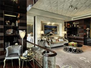 a living room with a couch and a chair at Chateau Star River Shanghai Minhang in Shanghai