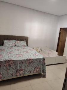 En eller flere senge i et værelse på Recanto João E Maria