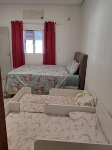 En eller flere senge i et værelse på Recanto João E Maria