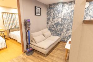 מיטה או מיטות בחדר ב-Guest House Kubo Homes Tengachaya 1