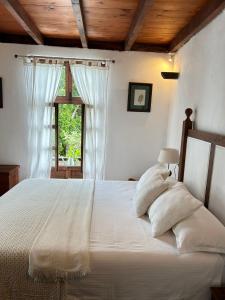 A bed or beds in a room at Casa La Aldaba