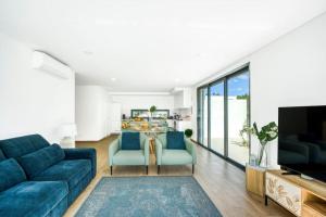 TV a/nebo společenská místnost v ubytování Villa Paradise Bay