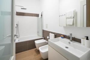 a bathroom with a sink and a toilet and a shower at Casa Stella in Vico Equense +15 photos
