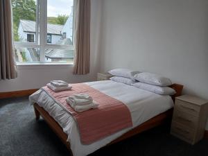 Postel nebo postele na pokoji v ubytování Taigh Sona