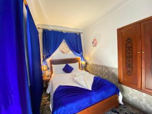 Postel nebo postele na pokoji v ubytování Riad Lazord