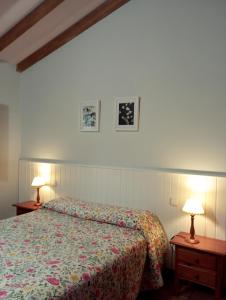 A bed or beds in a room at Apartamentos El Calambuco
