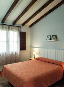 A bed or beds in a room at Apartamentos El Calambuco