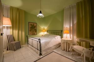 Postel nebo postele na pokoji v ubytování B&B Maison Biagetti