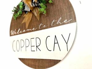 a sign that reads welcome for the upper cave at Copper Cay Family Friendly Central Location in Destin