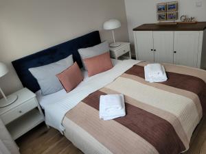 Ένα ή περισσότερα κρεβάτια σε δωμάτιο στο Przytulny apartament - Platan