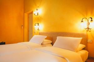 Postel nebo postele na pokoji v ubytování B&B La Rasora