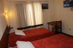Un pat sau paturi într-o cameră la Picol Hostal