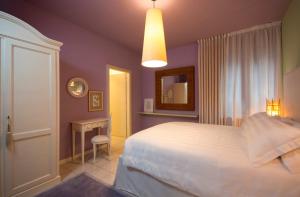 Postel nebo postele na pokoji v ubytování B&B Maison Biagetti