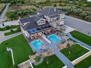 an aerial view of a house with a swimming pool at ALS COMFORT SUITES in Preveza