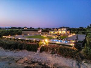 an aerial view of a mansion at night at ALS COMFORT SUITES in Preveza