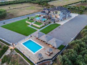 an aerial view of a house with a swimming pool at ALS COMFORT SUITES in Preveza