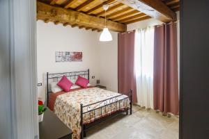 Postel nebo postele na pokoji v ubytování Borgo Felice + 26 fotografií