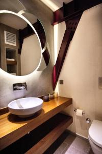 a bathroom with a sink and a mirror at Nuru Ziya Residences in Istanbul