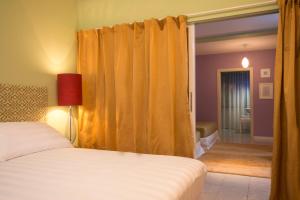 Postel nebo postele na pokoji v ubytování B&B Maison Biagetti