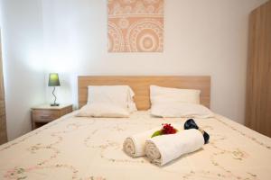 Ένα ή περισσότερα κρεβάτια σε δωμάτιο στο Coastal Getaway in Paradise