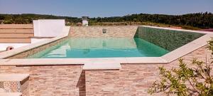 a swimming pool on top of a brick building at Sunset Vista Apartment B in Mação +35 photos
