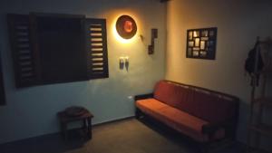 a living room with a couch and a window at Casa da Duna in Aracati