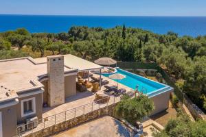 an aerial view of a villa with a swimming pool at Sunset Villa by PaxosRetreats in Gaios