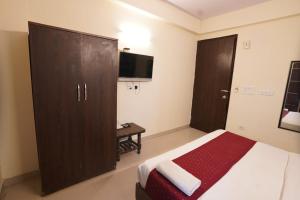 Postel nebo postele na pokoji v ubytování Hotel Tourist Palace