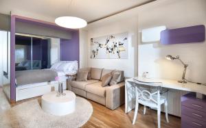 a living room with a couch and a bed at Nuru Ziya Residences in Istanbul