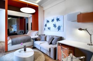 a living room with a couch and a bed at Nuru Ziya Residences in Istanbul